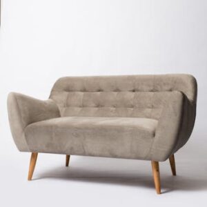 A modern beige sofa with wooden legs, perfect for stylish living room decor.